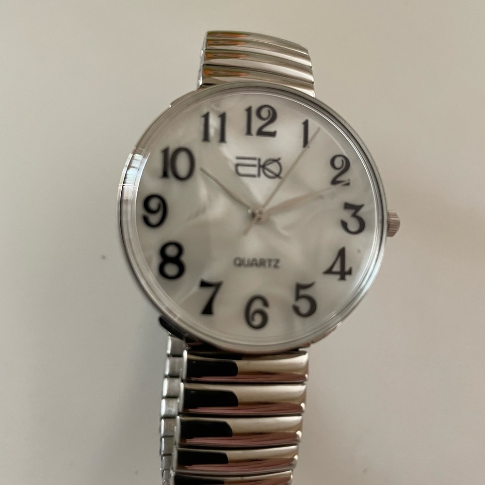 New silver EKO unisex stretch band watch with easy to read numbers-Japan quartz
